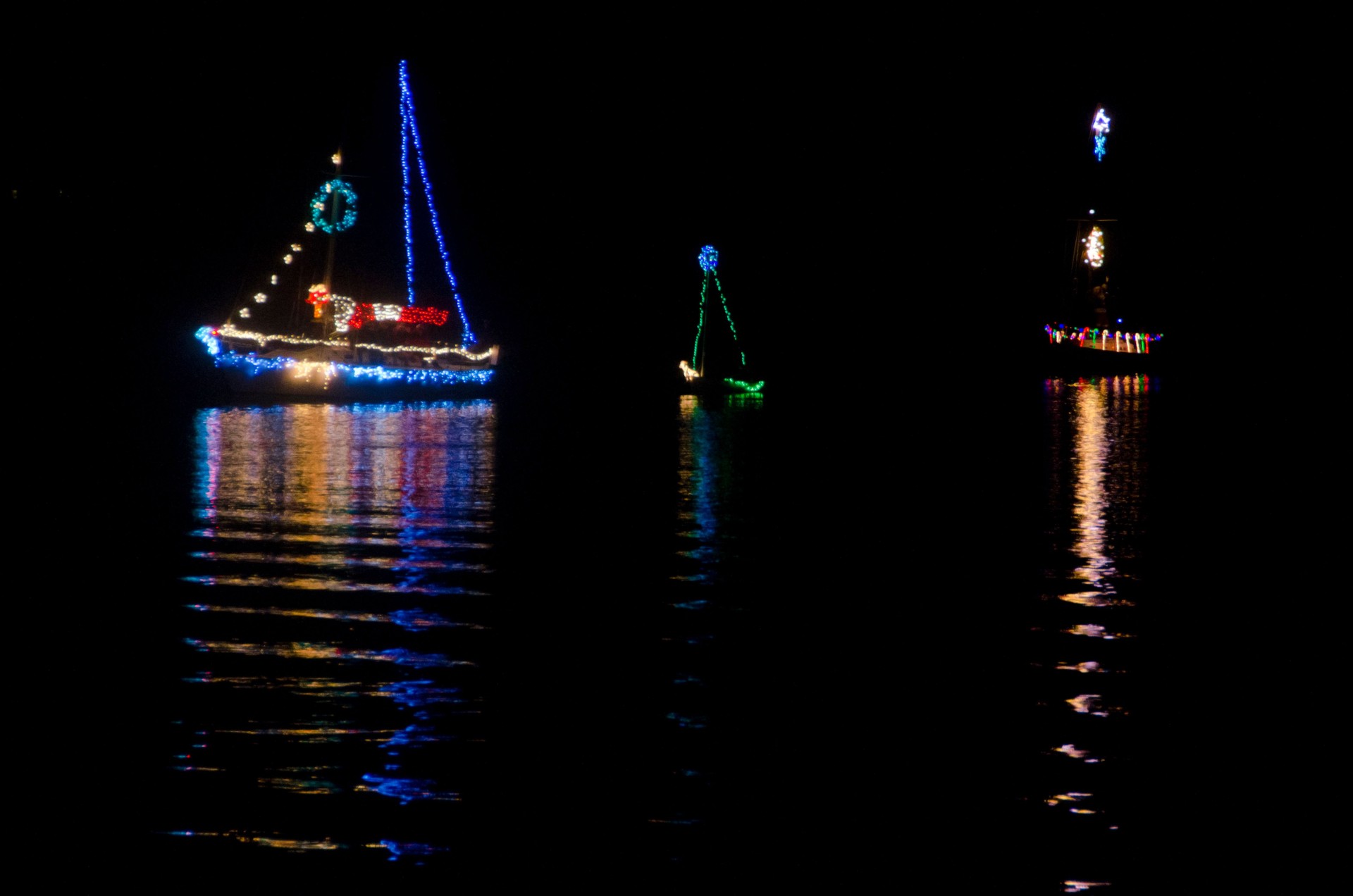 Christmas Sailboats in Nighttime Flotilla