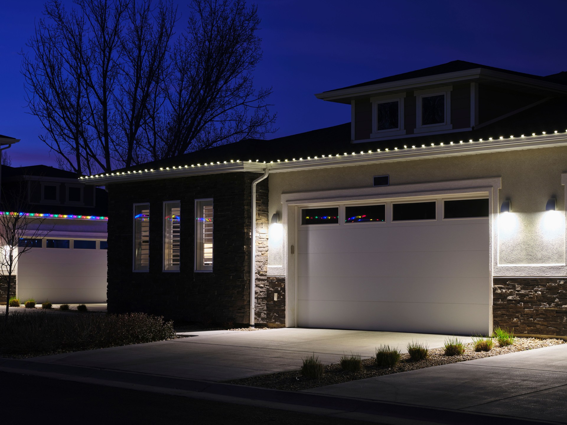 House With Christmas Lights at Night Professional Installation